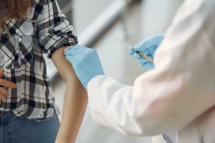 A woman getting vaccinated