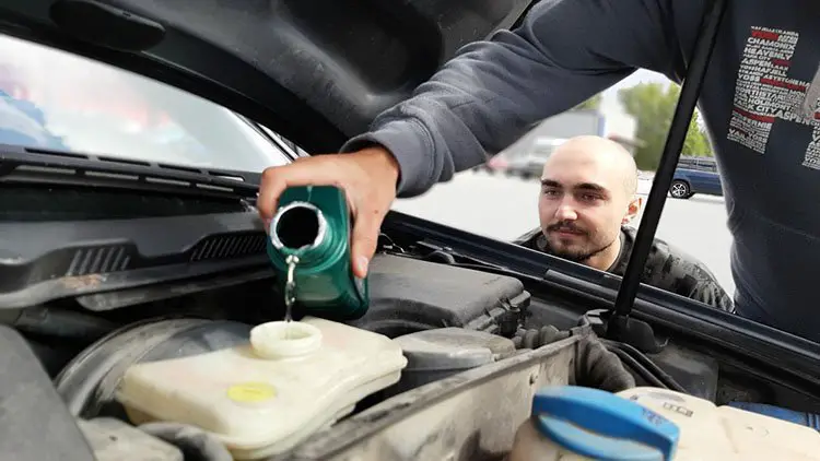 Putting oil in the car