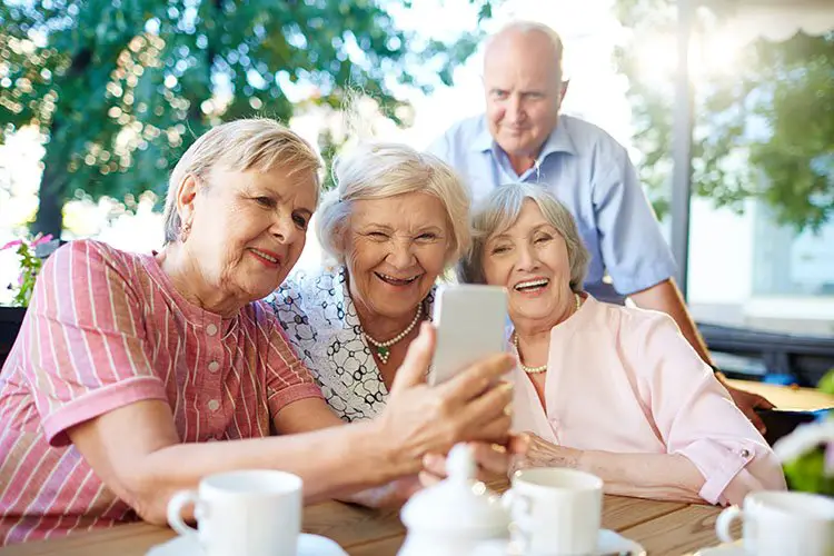 Seniors friends laughing together