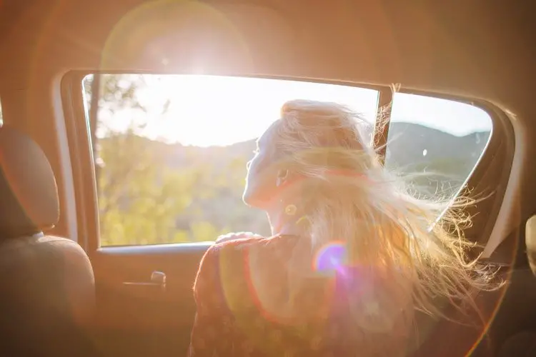 Woman looking out the car's window