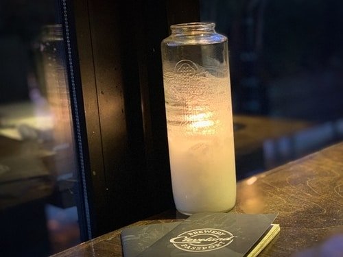 candle and beer passport in market garden