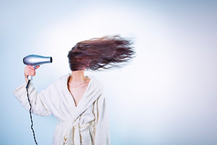 woman drying hair