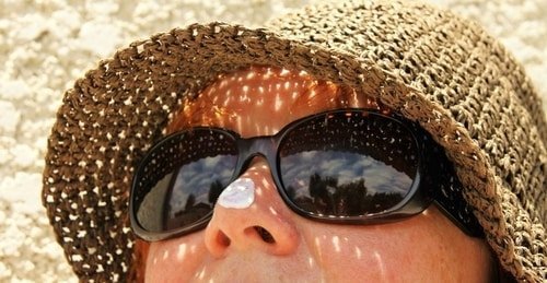 woman with sunscreen on tip of nose