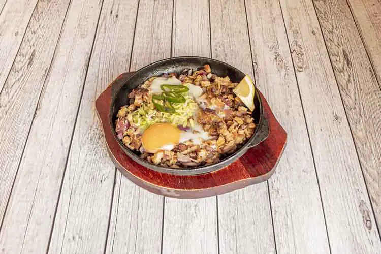 Sisig is a Filipino food of Pampanga origin. It is made with pig